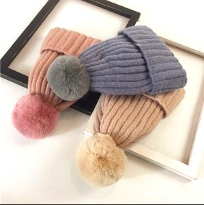 pink beanie hat with pom pom